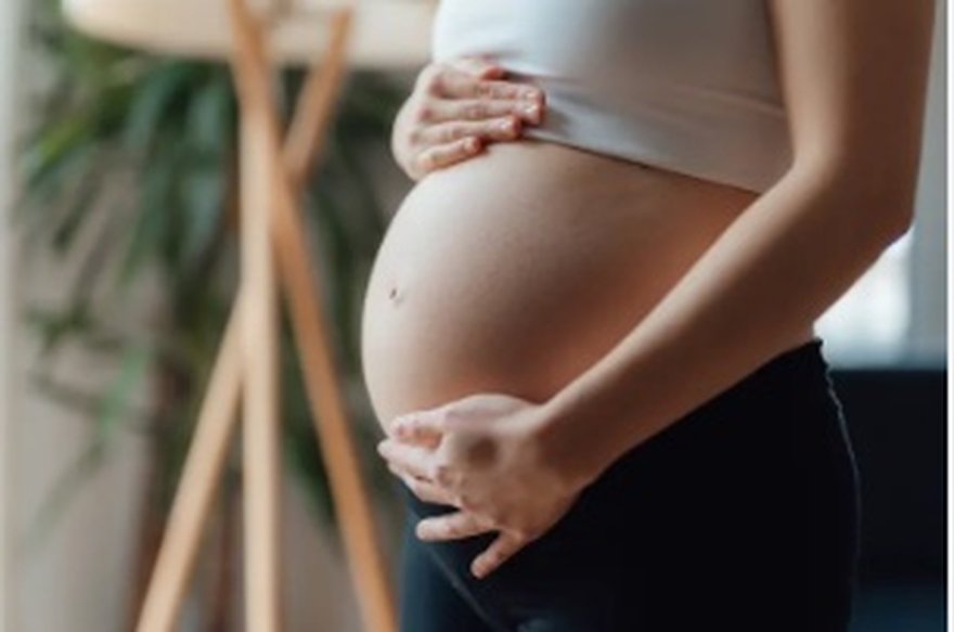 Pregnant woman, illustrating safe ingrown hair care during pregnancy
